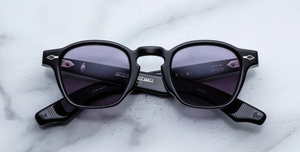 jacques marie mage zephirin fumee eckige sonnenbrille in schwarz mit grauen gläsern