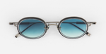 sato acamar II as/BB-1 ovale sonnenbrille aus titan in silber und schwarz mit blauen verlaufsgläsern