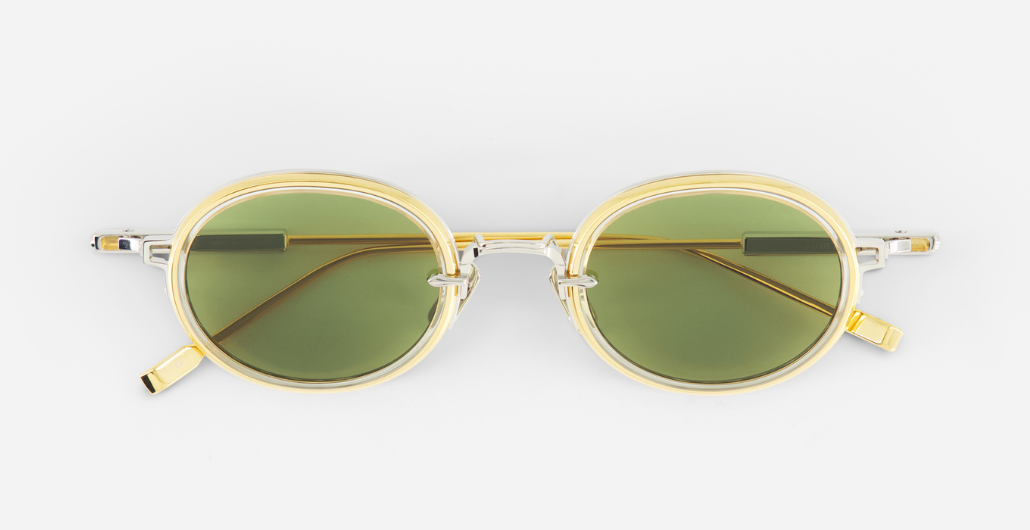 Sato Acamar II P/YG-1 ovale sonnenbrille aus titan in gold und platinum mit grünen gläsern