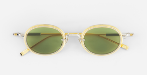 Sato Acamar II P/YG-1 ovale sonnenbrille aus titan in gold und platinum mit grünen gläsern