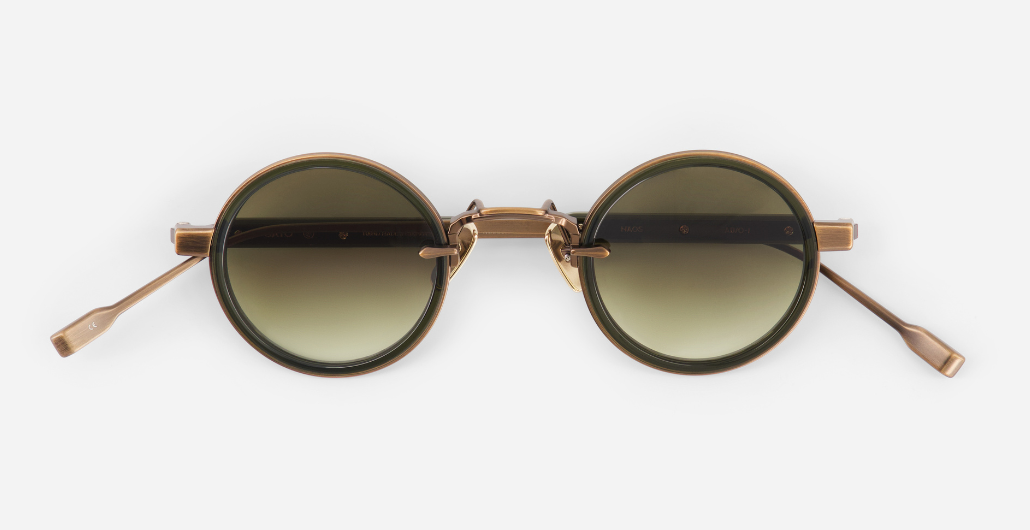 sato naos ab/o-1 ovale sonnenbrille aus titan und acetat in bronze und olive mit grün verlaufenden gläsern