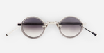 sato naos P/GC-1 ovale sonnenbrille aus titan und acetat in silber und grau mit grauen verlaufsgläsern