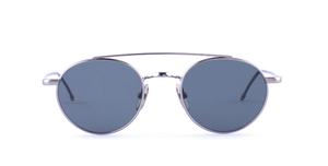 thom browne 101a 035 ovale sonnenbrille in silber mit grauen gläsern