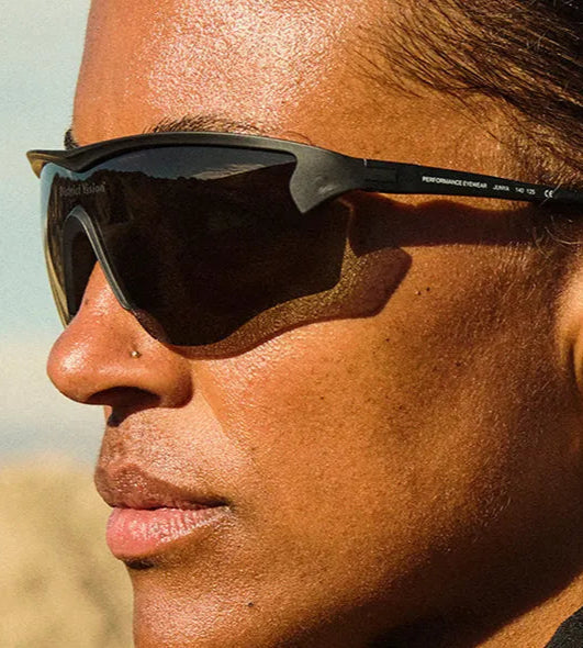 Female Model wearing district vision sunglasses