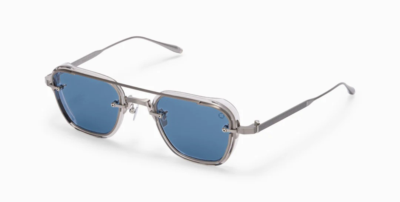 akoni jura crystal grey eckige sonnenbrille in grau und silber mit blauen gläsern