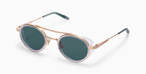 akoni astria crystal clear ovale sonnenbrille aus titan und acetat in transparent und gold mit grünen gläsern