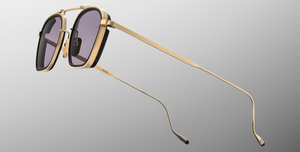 jacques marie mage baudelaire 2 ebony eckige sonnenbrille aus titan und acetat in gold und schwarz marmoriert mit grau blauen gläsern