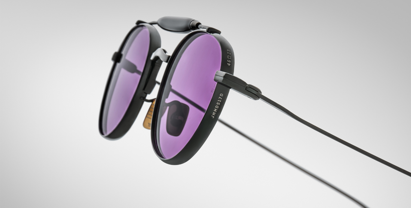 jacques marie mage dasan spider ovale sonnenbrille in schwarz mit violetten gläsern