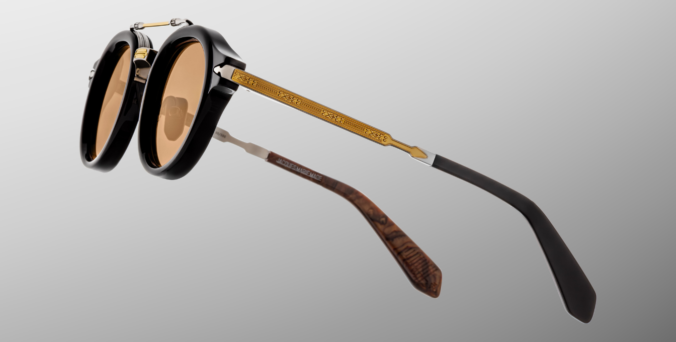 jacques marie mage hudson noirx runde sonnenbrille in schwarz und silber mit orangen gläsern