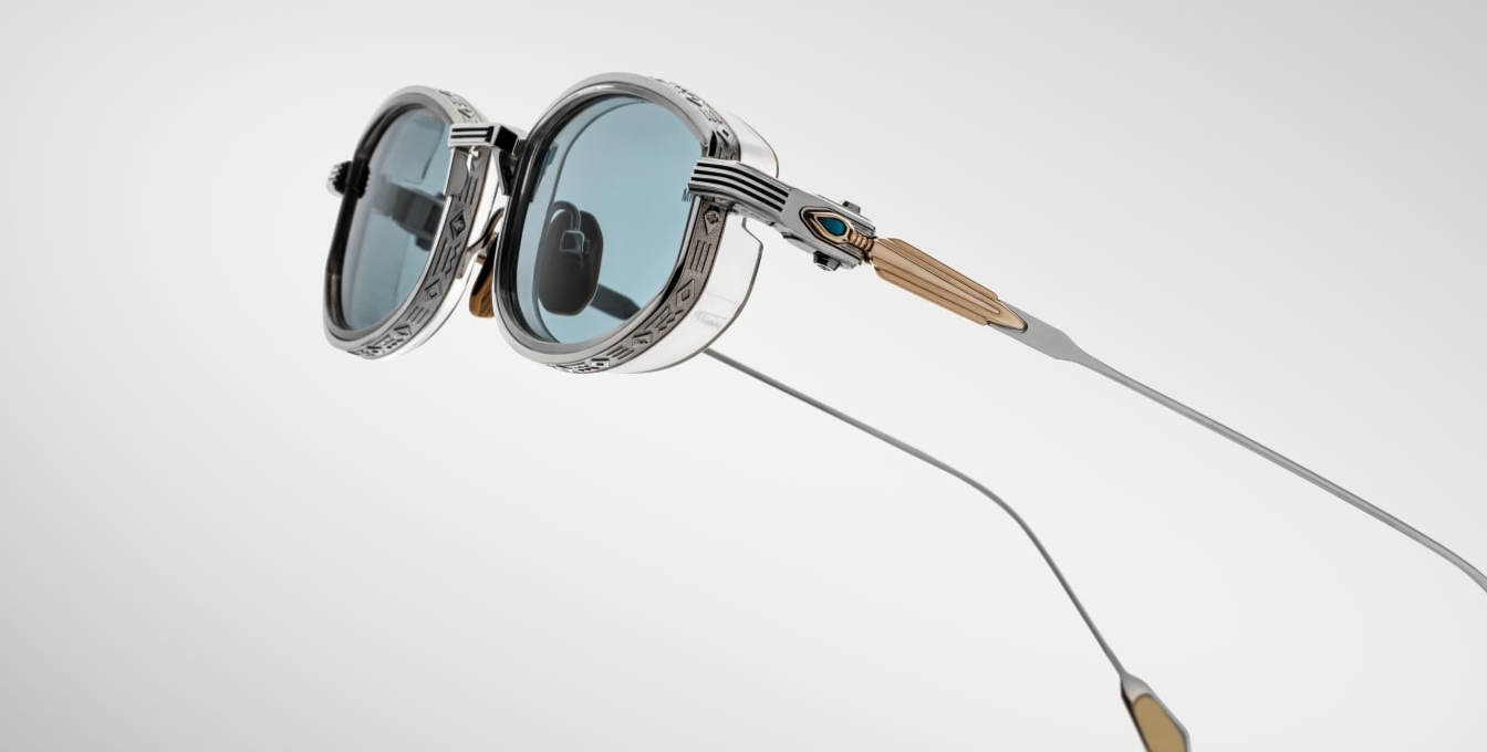 jacques marie mage last frontier hardin gaia ovale sonnenbrille in silber und gold mit transparenten Acetat und hellblauen gläsern