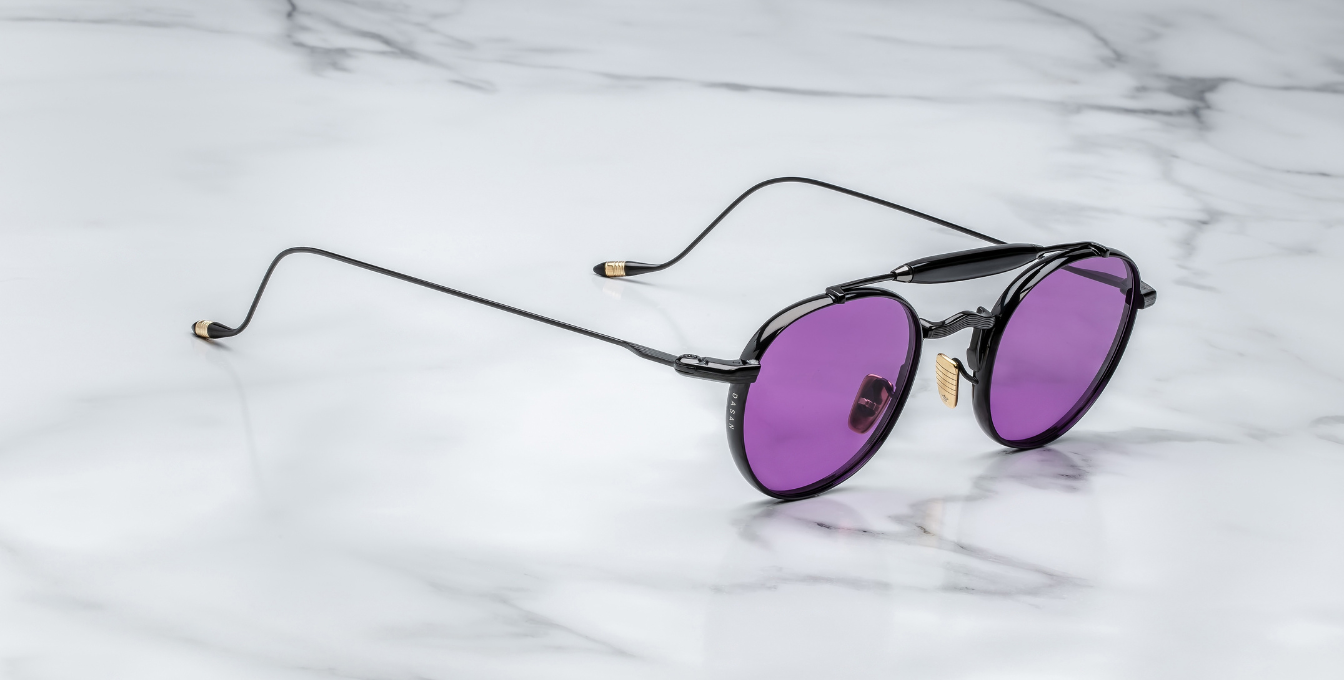 jacques marie mage dasan spider ovale sonnenbrille in schwarz mit violetten gläsern