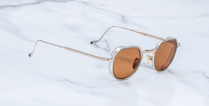 jacques marie mage dixon darjeeling pantoförmige sonnenbrille aus titan und acetat in gold und taupe mit orangenen gläsern