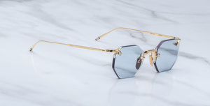 jacques marie mage el dorado ciel achteckige randlose sonnenbrille in gold mit blauen gläsern