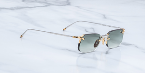 jacques marie mage fonda electrum eckige randlose sonnenbrille aus titan in silber und gold mit grünen verlaufsgläser
