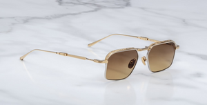 jacques marie mage koenig roma, eckige sonnenbrille in gold und silber mit braunen verlaufsgläser