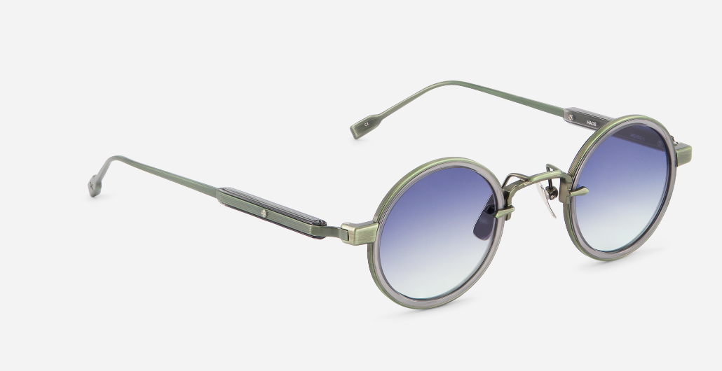 sato naos mg/gc-1 runde sonnenbrille aus titan und acetat in grün und grau mit blauen verlaufsgläsern