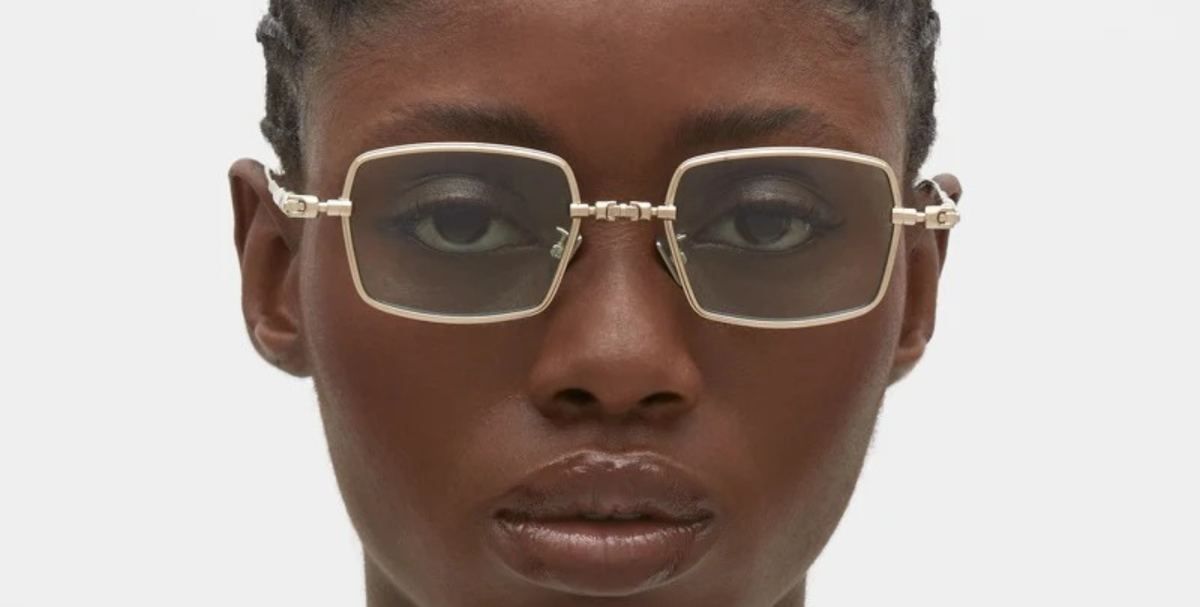 kuboraum H69 LG eckige Titansonnenbrille in gold mit hellgrpnen gläsern